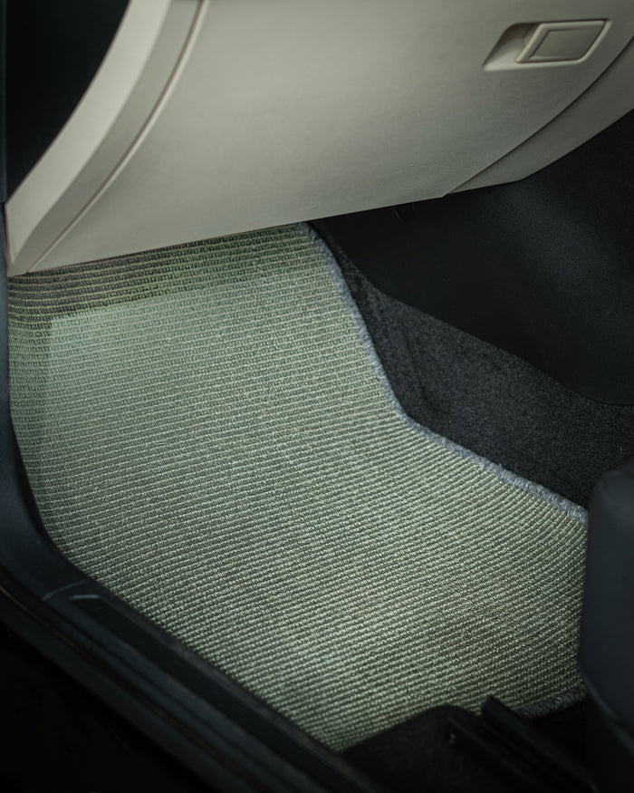Nerova Silver Grey bouclé sisal mats fully installed — front and rear rows, silver grey natural sisal in car interior