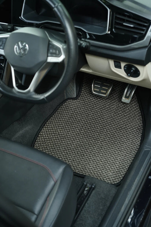 Close-up of Nerova Kari Tiger Eye sisal mat texture — deep charcoal medium-weave natural sisal, custom car mat India