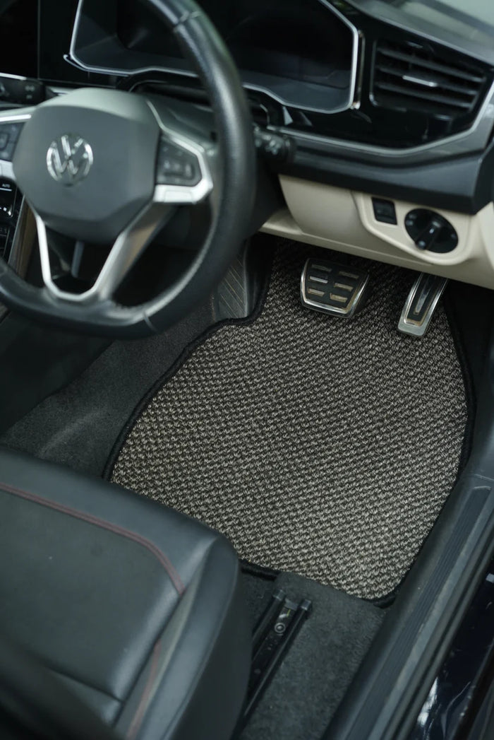 Close-up of Nerova Kari Tiger Eye sisal mat texture — deep charcoal medium-weave natural sisal, custom car mat India