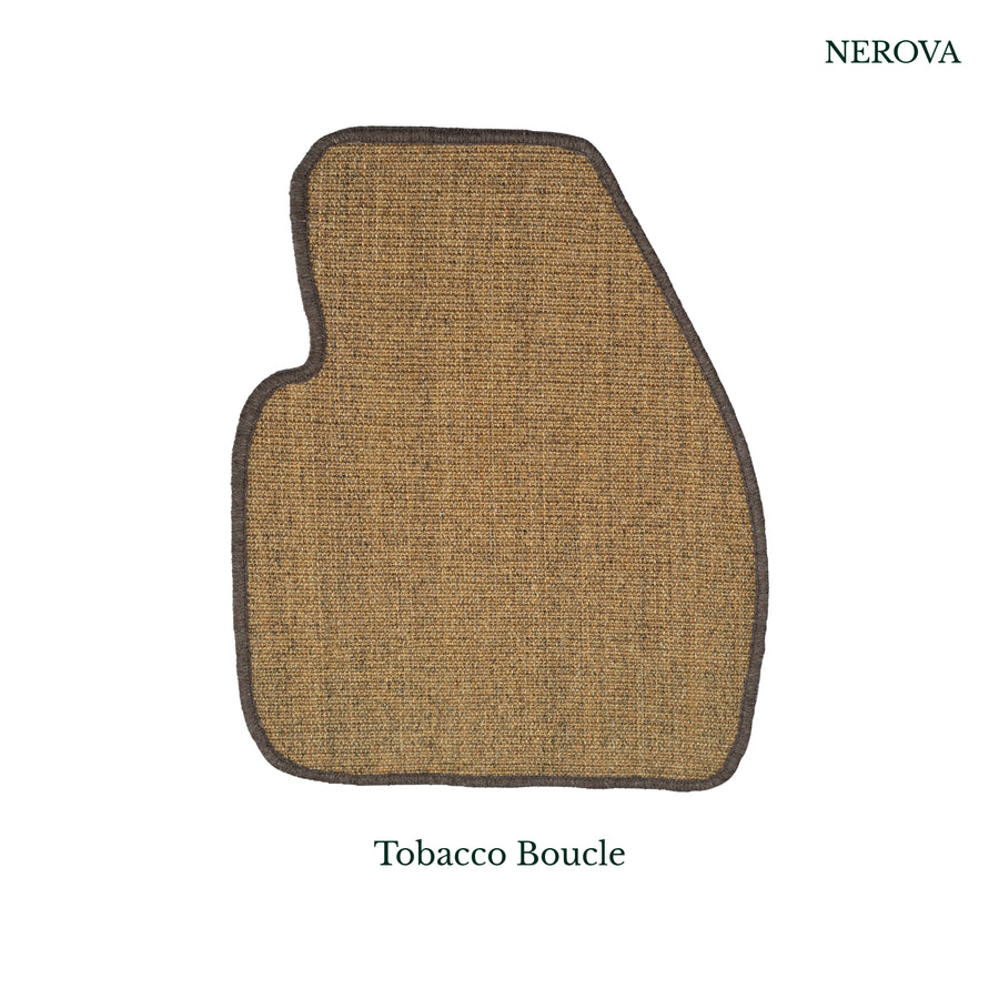Nerova Tobacco bouclé sisal car mat in driver footwell — warm brown flat-weave natural sisal, premium car mat India